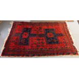 Middle eastern design red ground carpet having geometric floral and foliate designs. (B.P. 21% +
