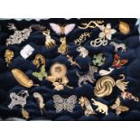 Box file of assorted vintage brooches, varying designs: dogs, lizards, butterflies, flowers and