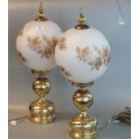 Pair of modern oil lamp style brass electric table lamps with glass floral shades. 60cm high approx.