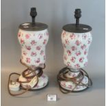 Pair of floral decorated ceramic baluster shaped electric table lamp bases. 30cm high approx. (2) (