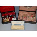 Two jewellery boxes, one of Oriental design, with the interiors revealing assorted costume jewellery