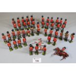 Collection of vintage Britains lead soldiers to include a band, riflemen, men on parade a Union Jack