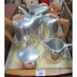 Piquotware set to include: Tea pot, Coffee pot and Water jug with milk jug and sucrier on a cream
