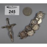 A bracelet of three pence, a large 925 silver crucifix and. 5pta coin. (B.P. 21% + VAT)