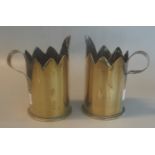 Trench art. Pair of German WWI brass shell cases, fashioned as jugs with castellated rims and loop