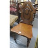 Victorian mahogany hall chair with moulded shield shaped back, serpentine moulded seat on turned