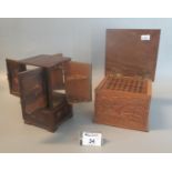 Two probably Japanese wooden cigarette dispensers, one as a 4 door cabinet, one as a heavily