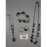 Collection of costume jewellery including an orange stone ring, green glass bracelet etc. (B.P.