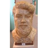 Ceramic bust of a bearded man, Hubert Nicholson. On a composition pedestal bust. 50cm high