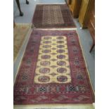 2 Similar middle eastern design rugs with central medallion designs, together with another beige