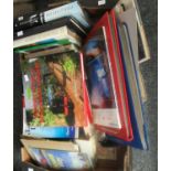 Box of assorted books along with two photograph albums, one empty and one with family photographs.