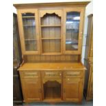 Modern oak 2 stage cabinet back dog kennel dresser together with a similar oak single glazed cabinet