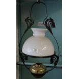 Early 20th century opaline glass shade with brass reservoir and art nouveau design metal, hanging