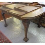 Late Victorian mahogany extending dining table with 2 additional leaves standing on carved