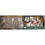 Two boxes of assorted ornaments to include Wade animals, Hummel figurines, miniature Staffordshire