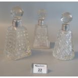 Three late Victorian silver topped scent bottle with faceted stoppers and conical body. Chester