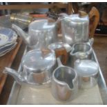 Tray of Piquot ware tea and coffee set to include two teapots, coffee pot, two milk jugs, and two