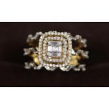 An 18ct gold diamond cluster ring with diamond set triple band. Ring size P. Approx weight 8.6