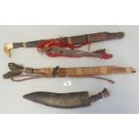 Nepalese kukri with badly damaged wooden handle and leather scabbard, together with a Malay Parang