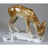A German porcelain model of a Fawn on naturalistic base - marked to the base Germany 7650. (B.P. 21%