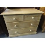 19th Century Small pine straight front chest of two short and two long drawers with turned handle