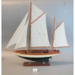 Well made model of a two-masted Cutter on a rectangular base. 57cm high approx overall. (B. P. 21% +