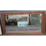 Large advertising mirror 'Scots Greys Whisky, established 1813'. Pine frame. 50 x 105cm approx. (B.