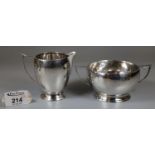 A silver sucrier and cream jug by Deakin & Francis Birmingham 1936 and 1937. Approx weight 6.