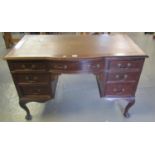 Mid 20th century Waring & Gillow mahogany knee hole writing desk with inset leather top and a bow