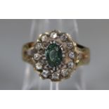A Georgian foiled green sapphire and diamond cluster ring with later 9ct gold band. Ring size N.