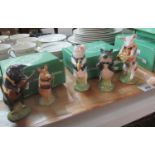 Three trays of Beswick china figures, the pig prom band: Matthew trumpeting pig, Richard, Chris