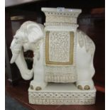 Large ceramic garden seat in the form of Caparisoned elephant on rectangular base. 60cm high approx.