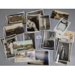 Collection of black and white female nude photographic postcards, together with a small selection of