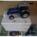 Universal Hobbies 1:16 scale model of a Ford 7000 Tractor in blue. (B.P. 21% + VAT) Broken wing