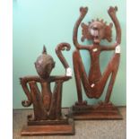 Two similar probably African stained wooden stylised ceremonial figures, probably depicting monkeys.