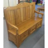 Natural pine arched back settle with open arms and lift seat. 164 cm wide approx. (B.P. 21% + VAT)
