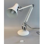 Angle poise white enamelled reading lamp on circular base. (B.P. 21% + VAT)