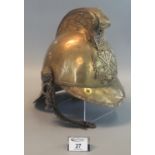 19th century Welsh brass fireman's helmet in relic condition but basically appearing complete, the