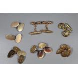 Two pairs of 9ct gold cuff links, a pair of silver cuff links and three pairs on costume cuff links.