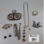 A collection of silver jewellery etc comprising a silver sovereign case, multi gem pendant, button