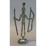 Tribal metal figure of archer with bow ,long arrow and headdress ,on circular pedestal bass. In