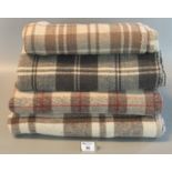 Four Welsh tartan blankets or rugs. (B.P. 21% + VAT)
