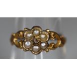 A Victorian yellow metal pearl set posy ring. Ring size M. Approx weight 1.3 grams. (B.P. 21% + VAT)