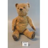 Vintage gold plush teddy bear with glass eyes and stitched nose, original pads. (B.P. 21% + VAT)