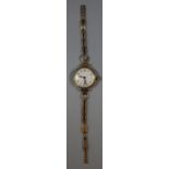 Ladies 9ct gold wrist watch with gold chain bracelet, with Arabic numerals to the face and seconds