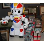 A collection of four toy robots. 'Emiglio the Robot', made by Giochi Preziosi Toys. A Robot tin safe