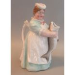 Late 19th Century German porcelain jug or novelty teapot in the form of a fishwife/cook with fish