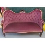 Victorian mahogany show frame double ended conversation couch with scroll cresting, buttoned