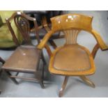 Mid 20th century oak capstan office armchair on quatrefoil base with padded seat. (B.P. 21% + VAT)