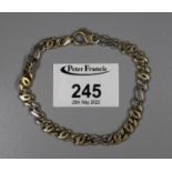 9ct yellow and white bracelet of heavy flattened links. Approx weight 17.9 grams. (B.P. 21% + VAT)